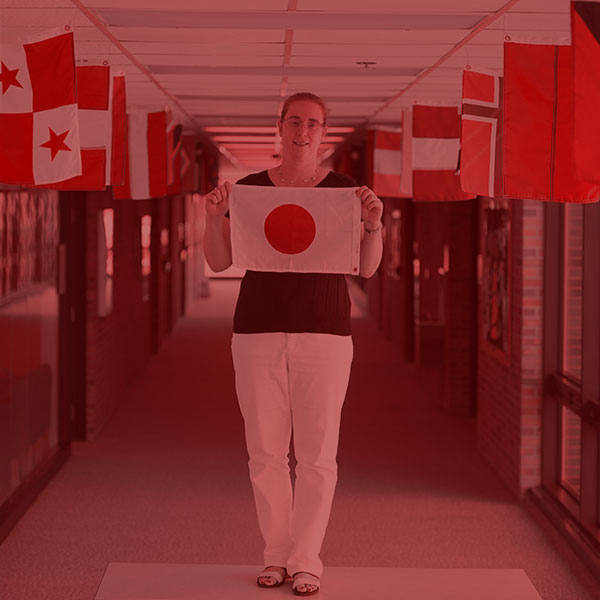 Monika Dix holding Japanese flag