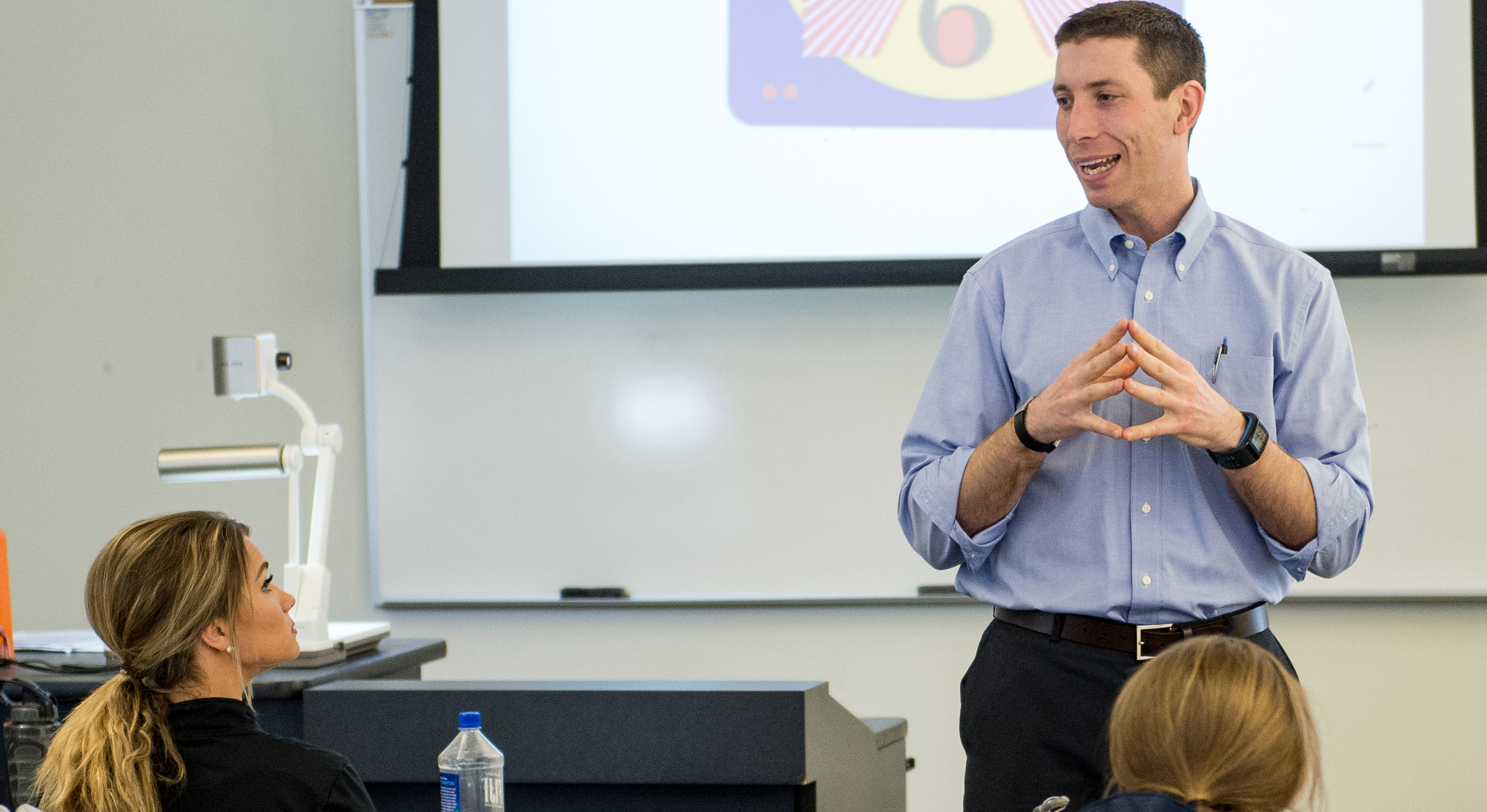 Faculty using a presentation to teach a class.