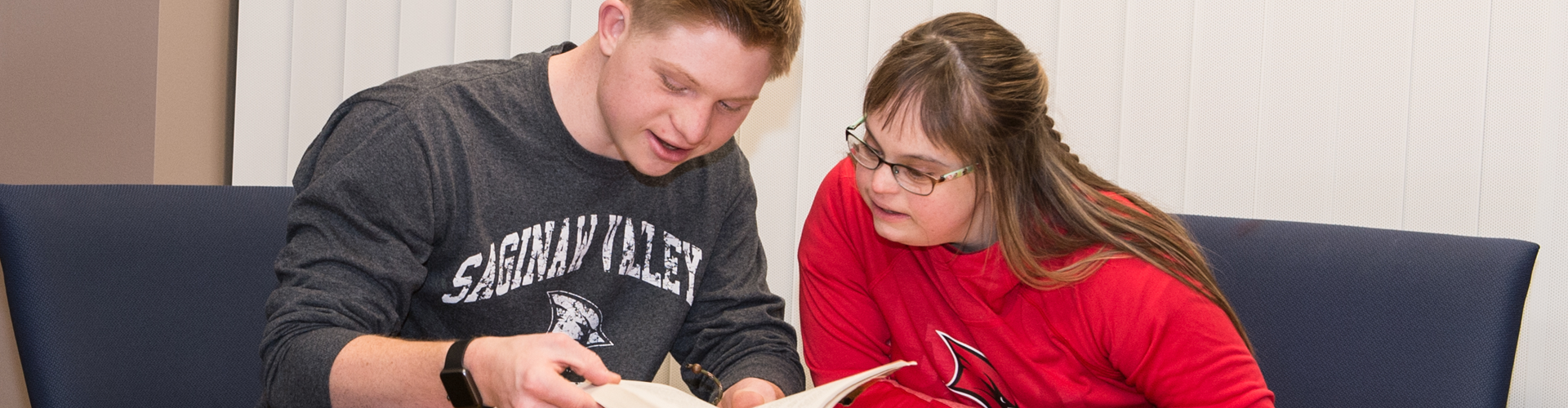 Two Think Cardinal students reading together