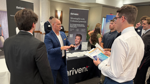 students gathered around an employer table during employment fair