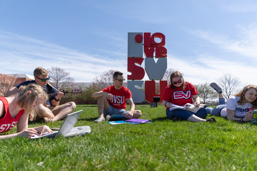Students in front of the I love SVSU sign in summer