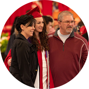 circle image of graduate with family at commecement