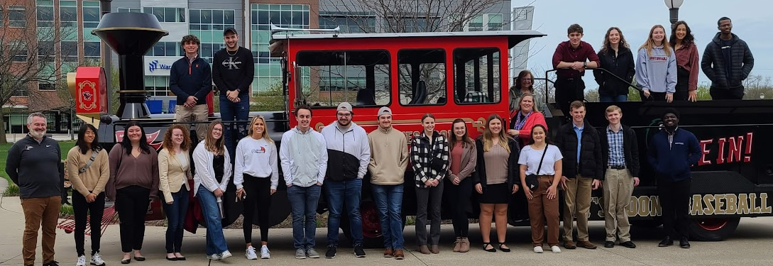 Garber Cardinal Business Edge Program students in Dayton, standing on a train