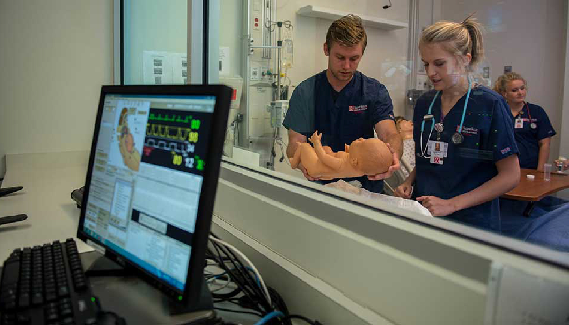Nursing students being monitored in a simulation