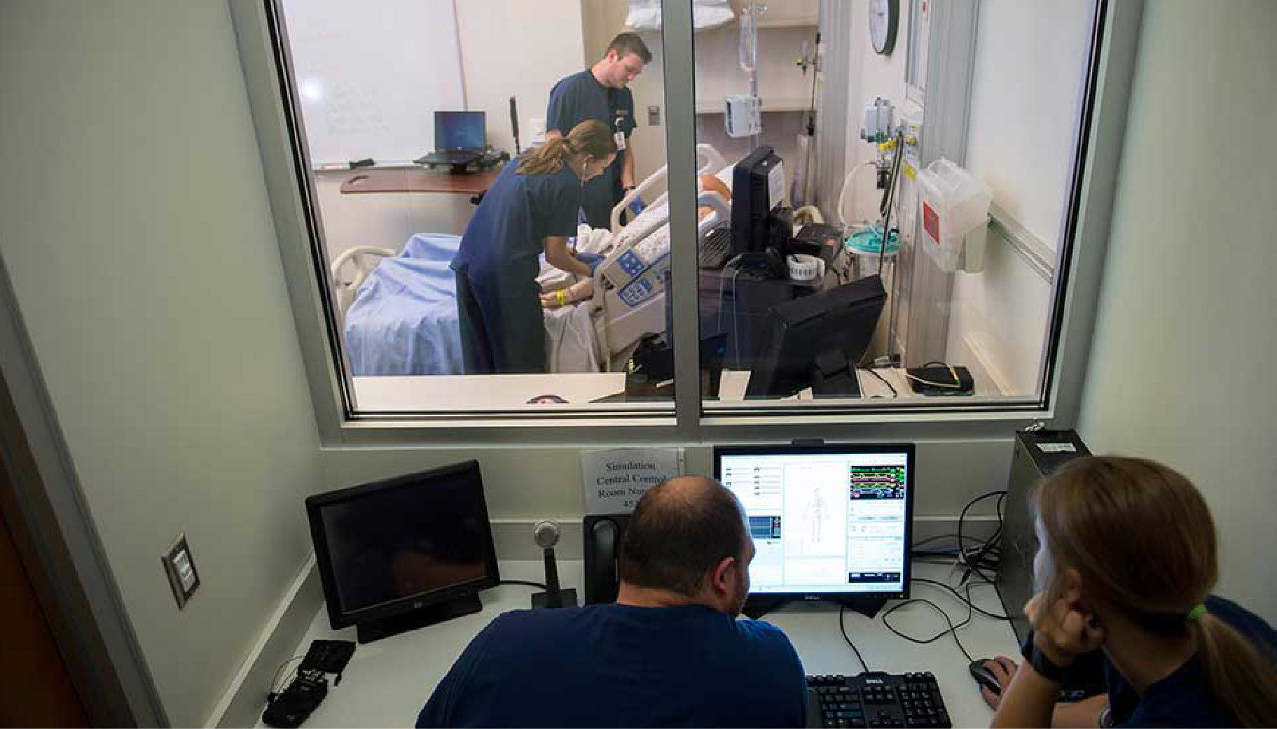 Two nursing students in a nursing simulation