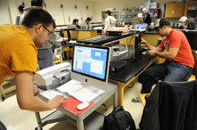 Students work in a physics lab.