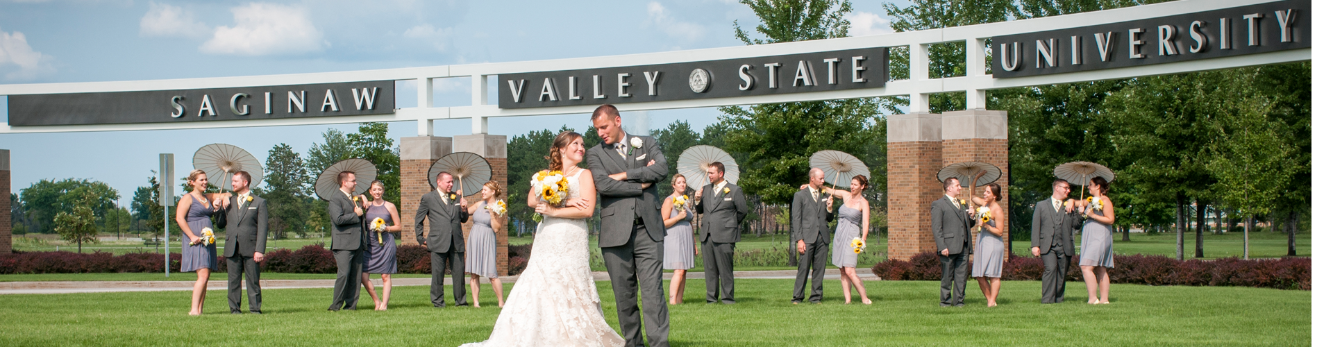 The Abbs Wedding Party in front of SVSU.