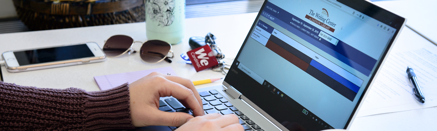 Student Typing on Computer