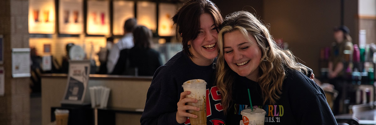 Two students enjoying coffee drink