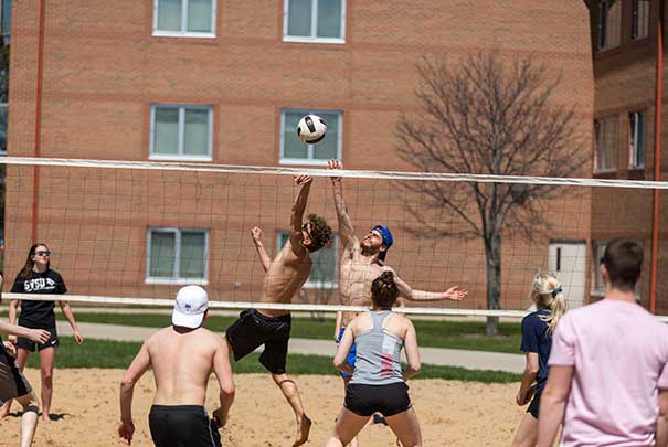 Students playing volleyball outside of LCS