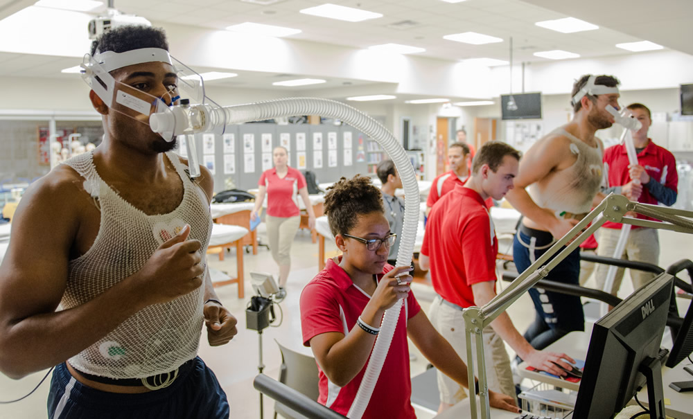 Students on treadmill and monitoring equipment