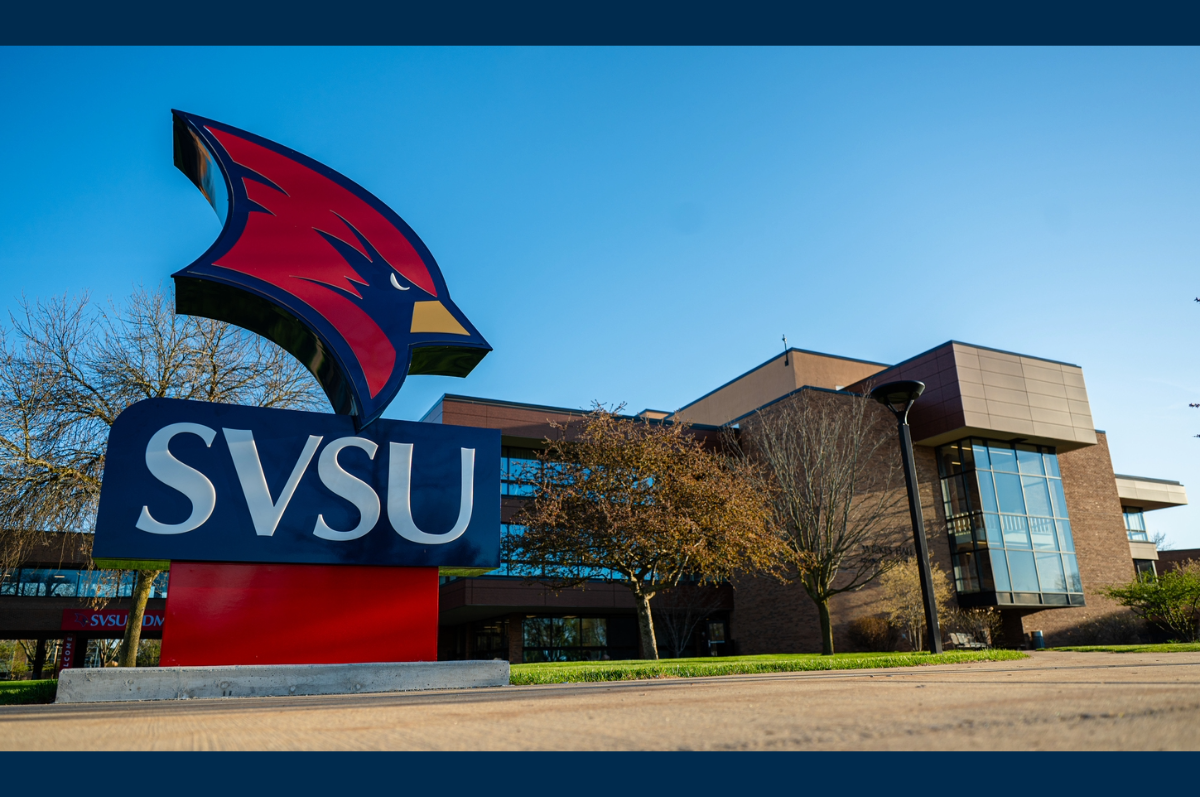 Cardinal head sign in front of building