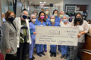 Nursing students with check