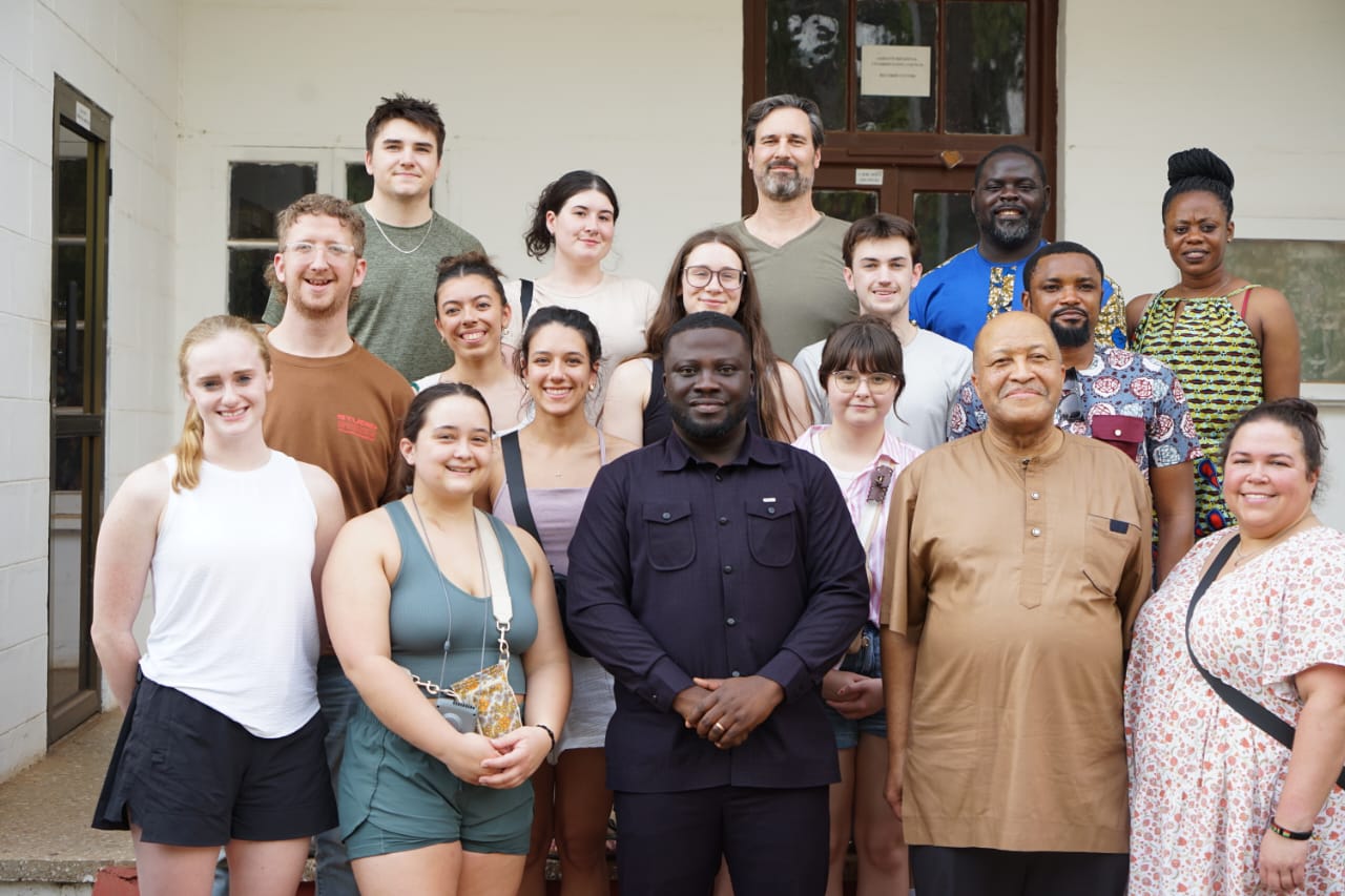 group of people standing in front of building