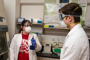 Tami Sivy with student in lab