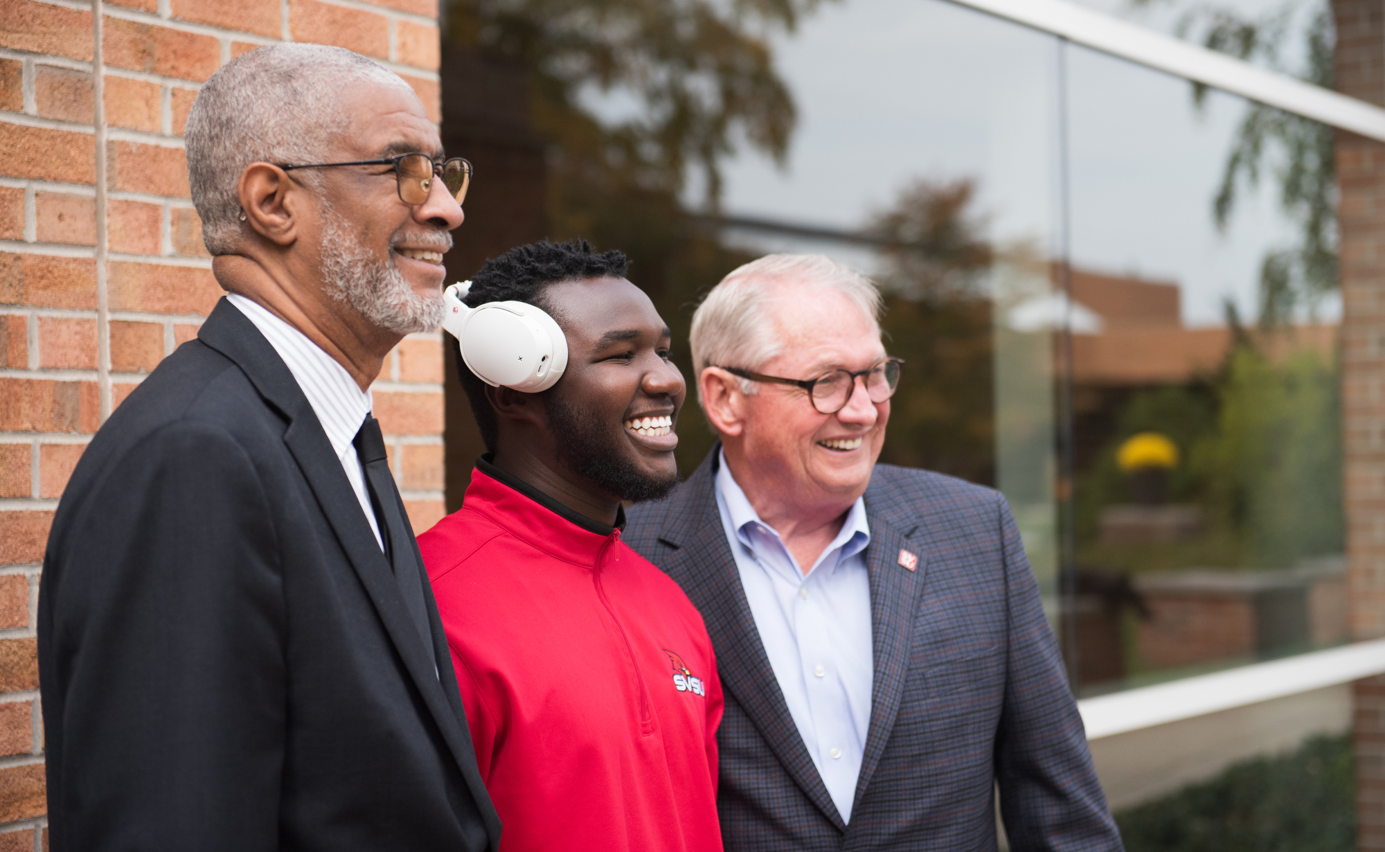 George Grant Jr. and Donald Bachand meeting with student outside