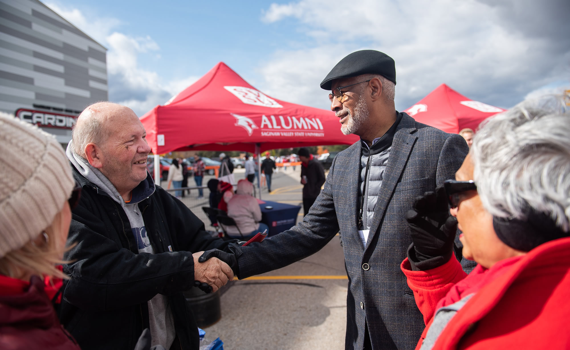 George Grant meeting with Alumni at football game