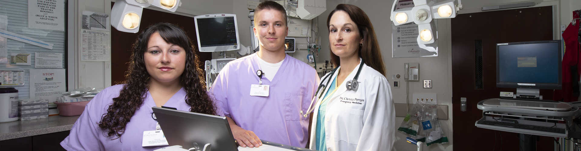 Medical Scribe students stand in a hospital with a doctor