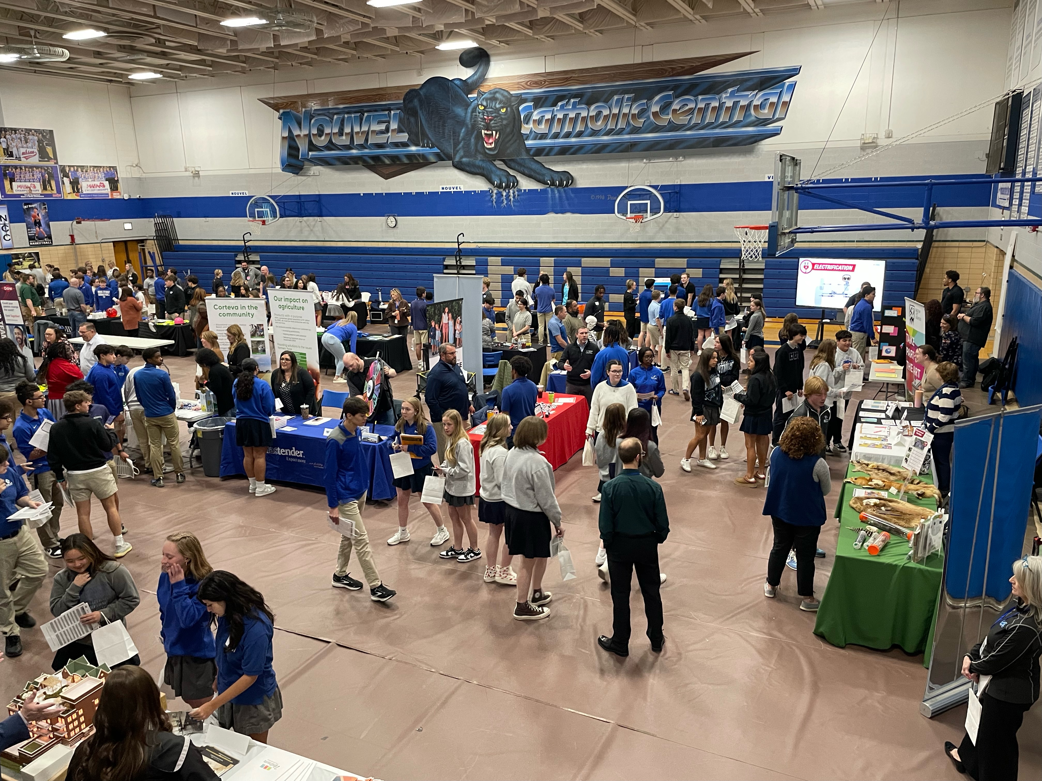 Students walking around meeting STEM professionals