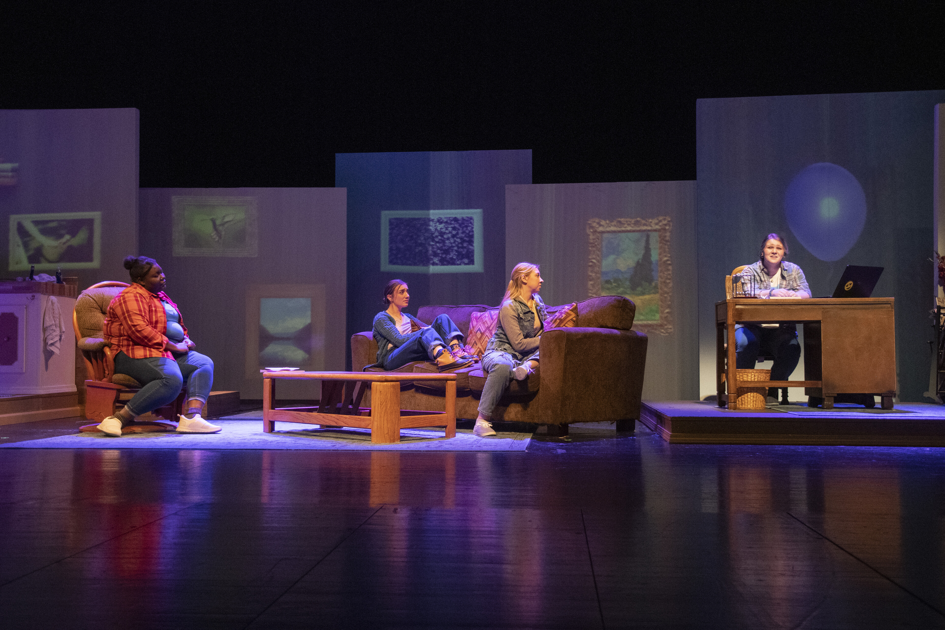 Theatre Production with mulitiple actors on stage in modern setting