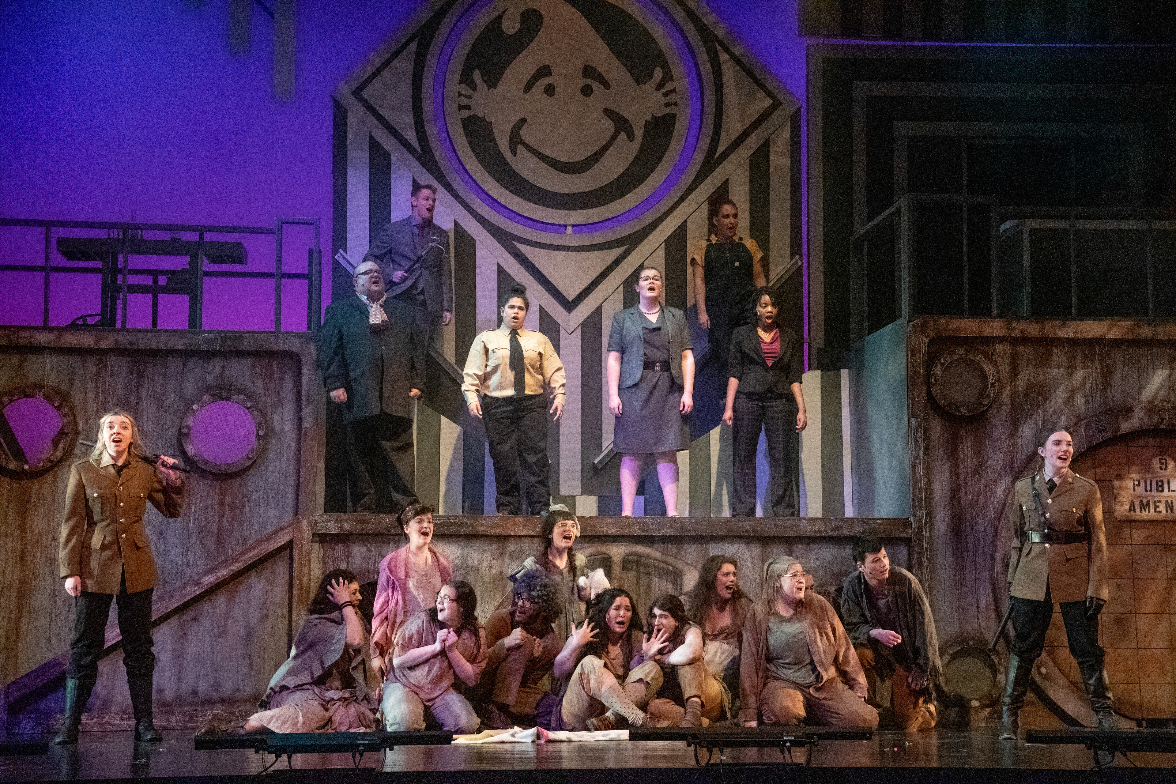 Theatre Production with many actors on stage in wartime setting