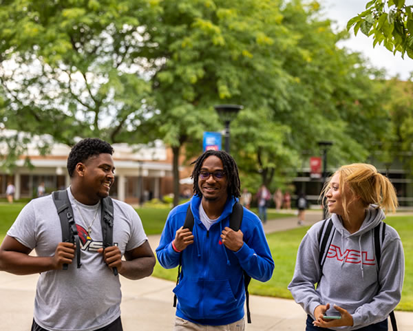Three students in outdoor commons
