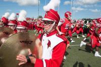 A Think Cardinal student participates in the SVSU marching band